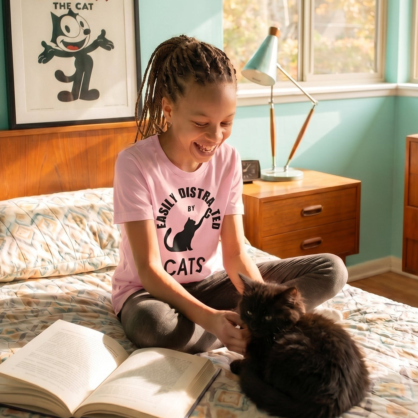 Easily distracted by cats retro-inspired youth graphic tee in lifestyle setting — Galactic Ink Club
