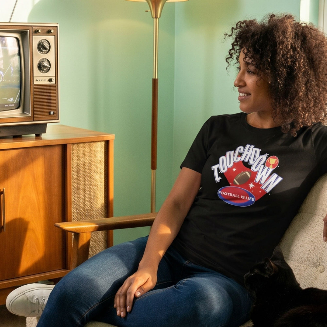 Football Retro-Inspired Graphic Tee on female model in black in mid-century modern living room setting — Galactic Ink Club
