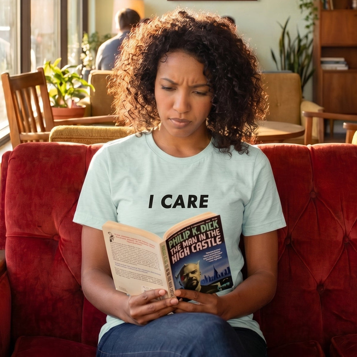 I Care retro-inspired graphic tee light edition worn by person in mid-century modern setting — Galactic Ink Club

