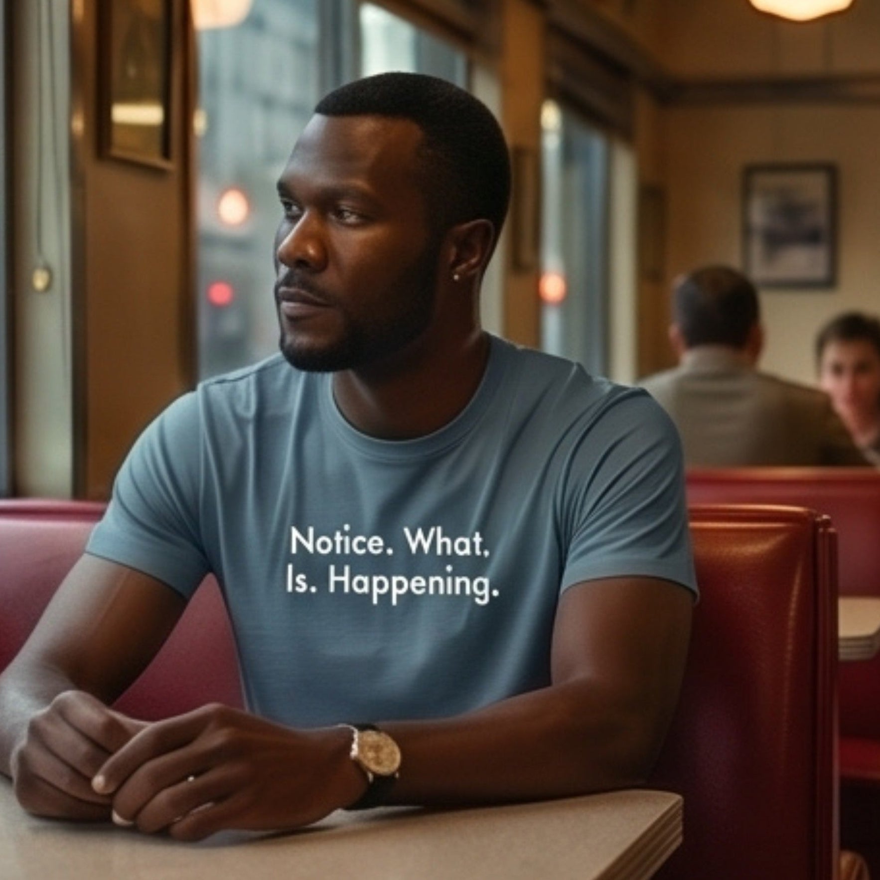 Notice retro-inspired graphic tee worn by man in retro diner booth — Galactic Ink Club