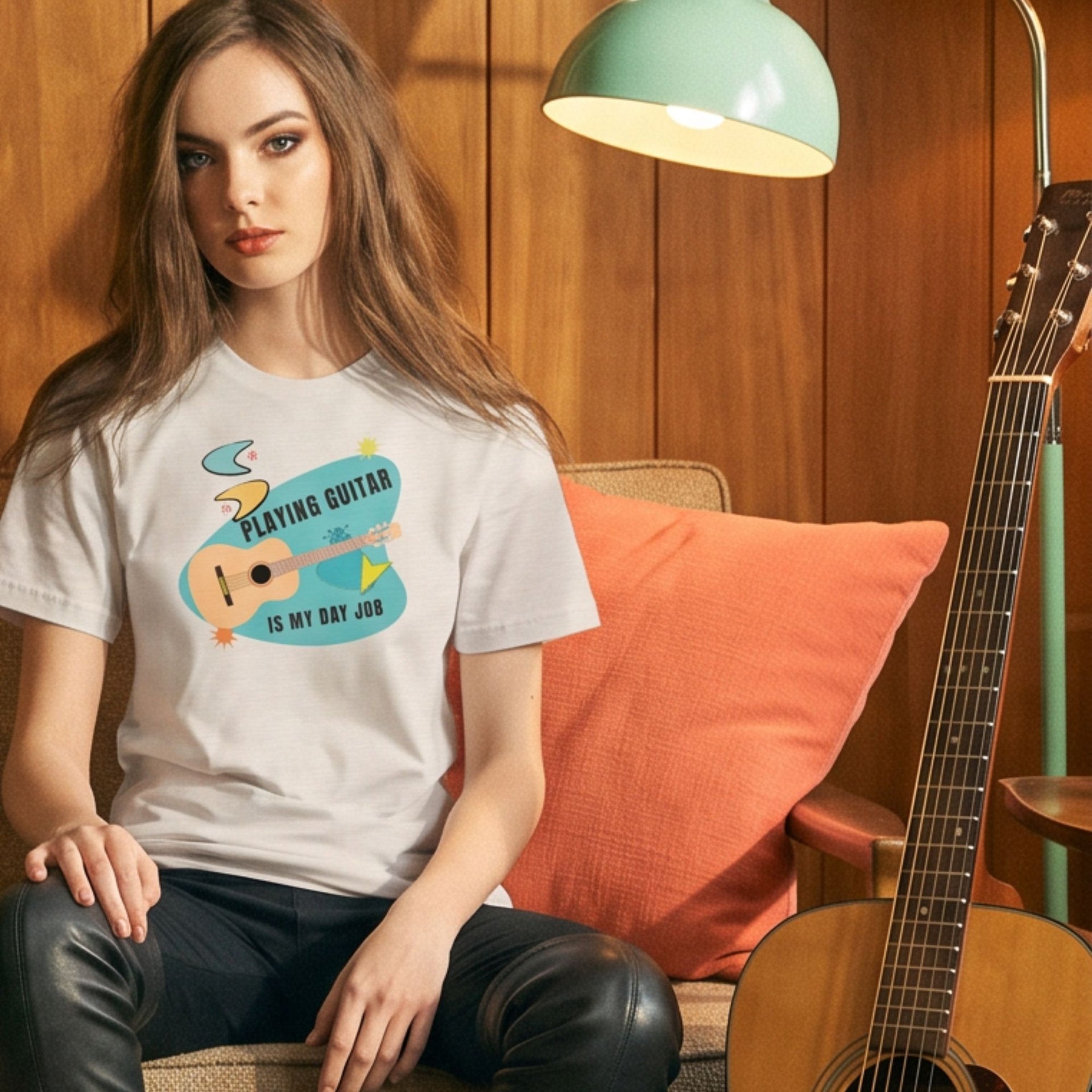Playing Guitar Day Job Retro-Inspired Graphic Tee on woman sitting indoors near guitar — Galactic Ink Club
