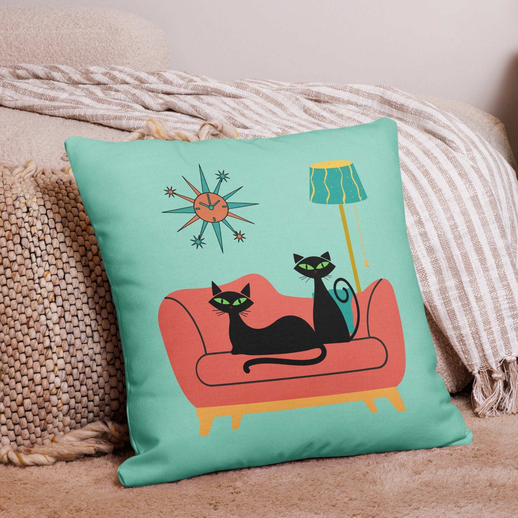 Retro black cat coral couch throw pillow in mid-century modern room setting — Galactic Ink Club