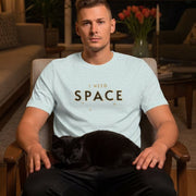 Space Retro-Inspired Graphic Tee retro graphic t-shirt on man sitting indoors — Galactic Ink Club

