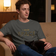 Space Retro-Inspired Graphic Tee retro graphic t-shirt on man sitting with cat in living room — Galactic Ink Club

