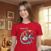 Things I Fly Retro-Inspired Graphic Tee Youth on a girl in a room with dragon pictures — Galactic Ink Club
